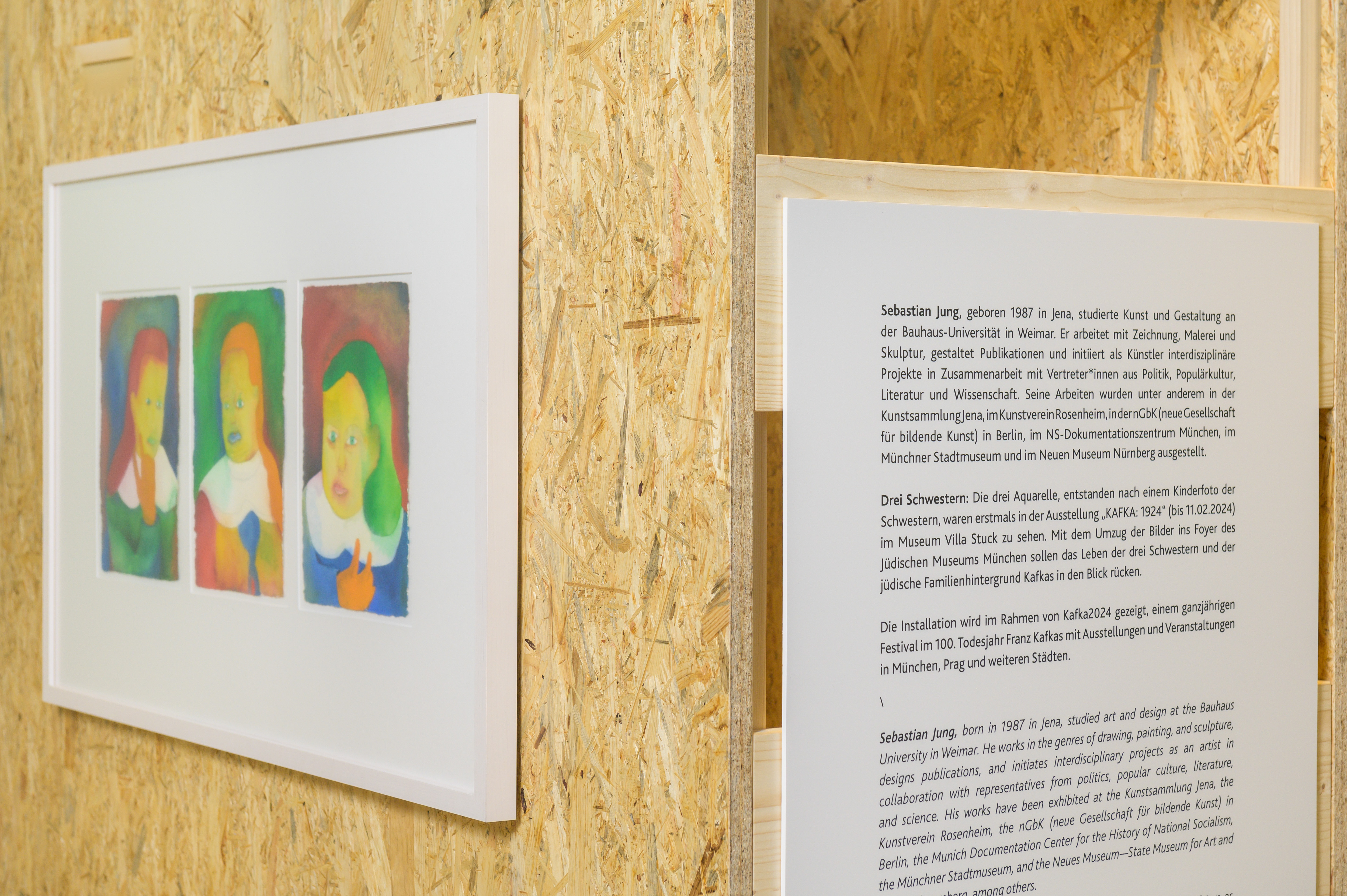 Installation view "Three Sisters" (detail with text panel and colourful watercolours), © Sebastian Jung 2023, Photo: Jewish Museum Munich / Daniel Schvarcz 